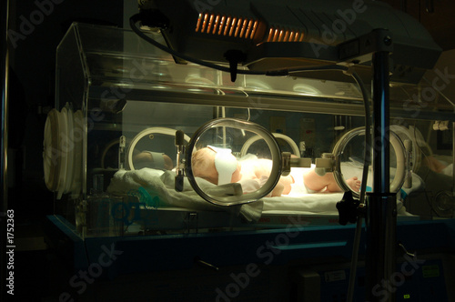newborn in isolette 3