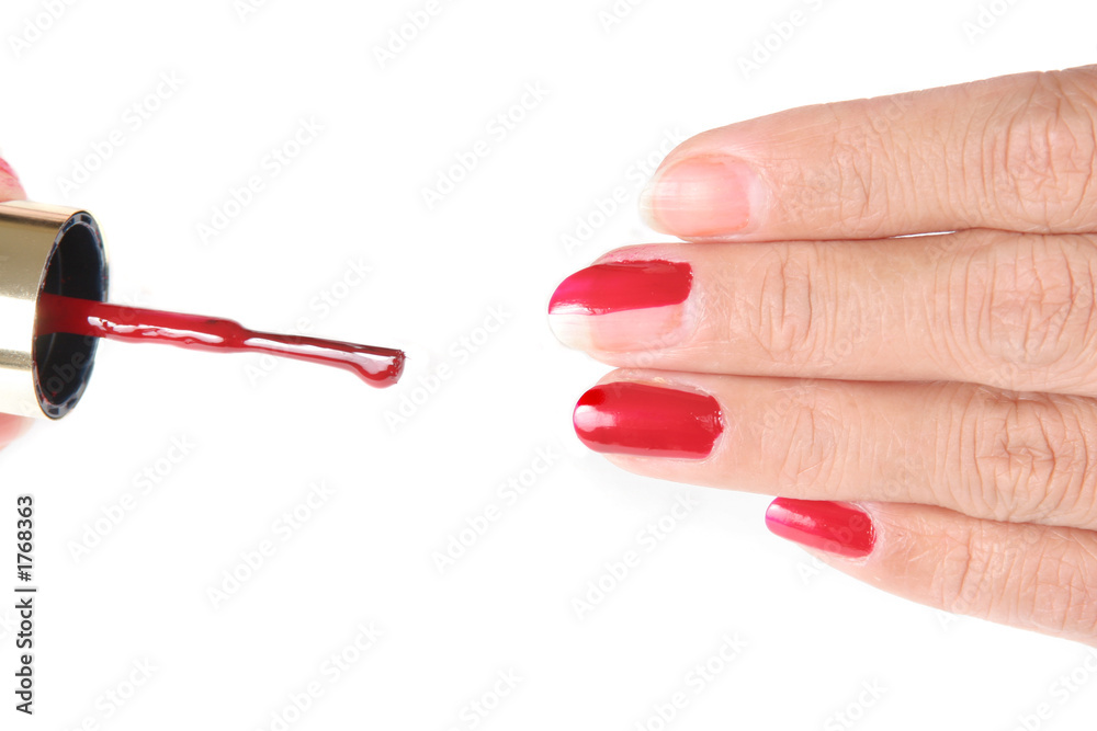 nails being painted red nails being painted red