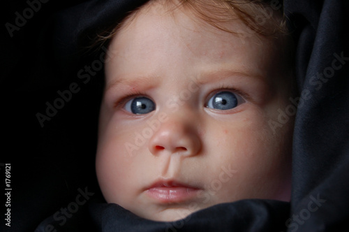 baby wrapped in black