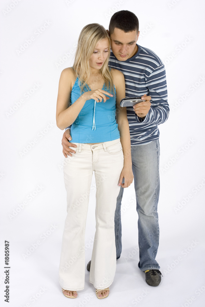 couple with mobile phone/palmtop couple with mobile phone/palmtop