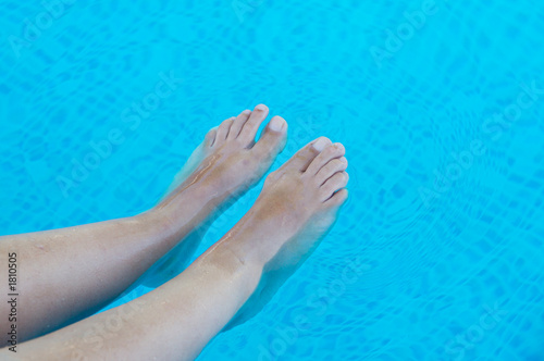 feet refreshing in swimming pool