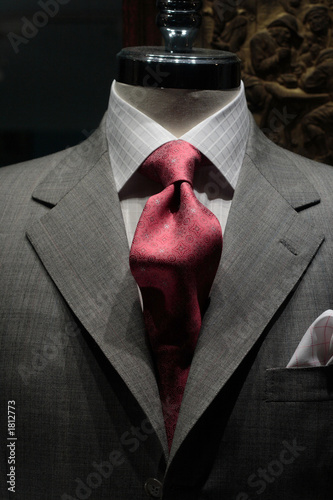 grey jacket with red tie