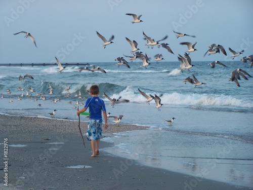 boy walking beach