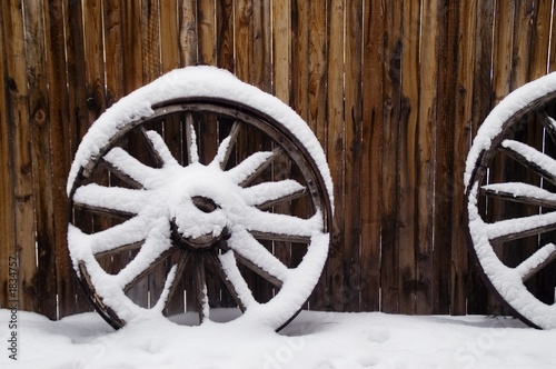 antique wagon wheels in snow