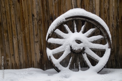 old wheel in snow