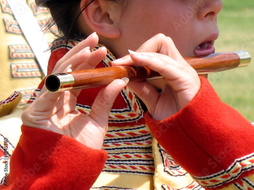 young girl playing flute in a colonial military band