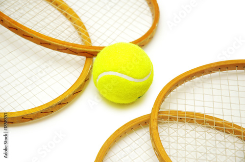 four tennis rackets and balls isolated on white © Elnur