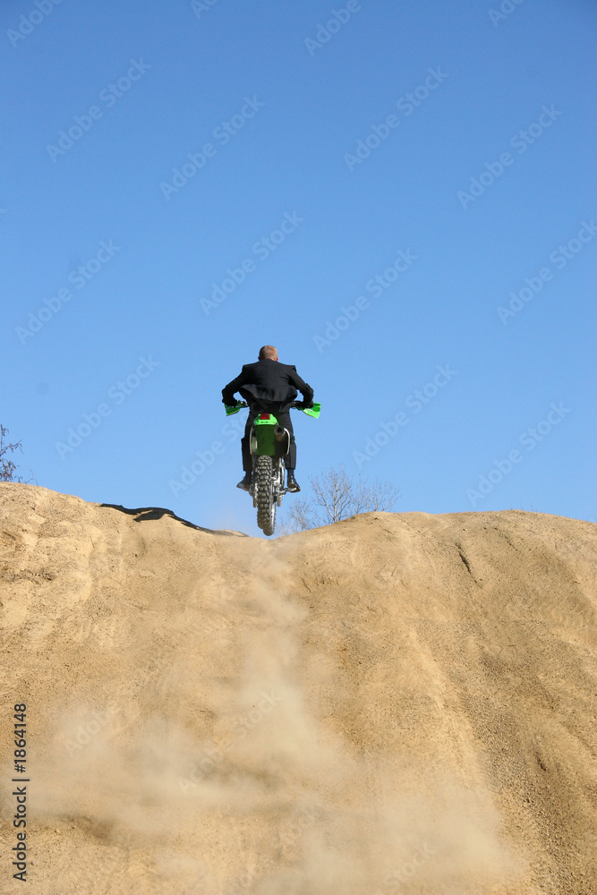 Fototapeta premium businessman on dirt bike