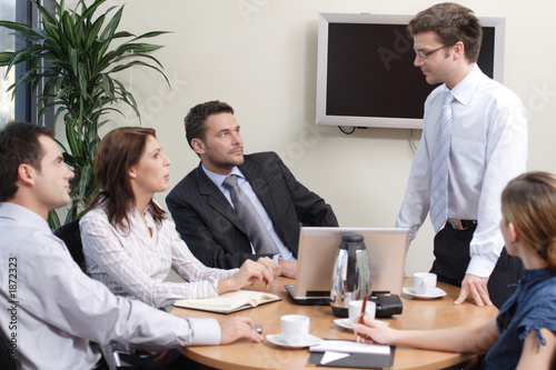 man explaining an idea to the group