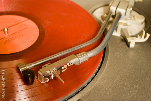 recordplayer with red lp records (33 1/3 rpm)