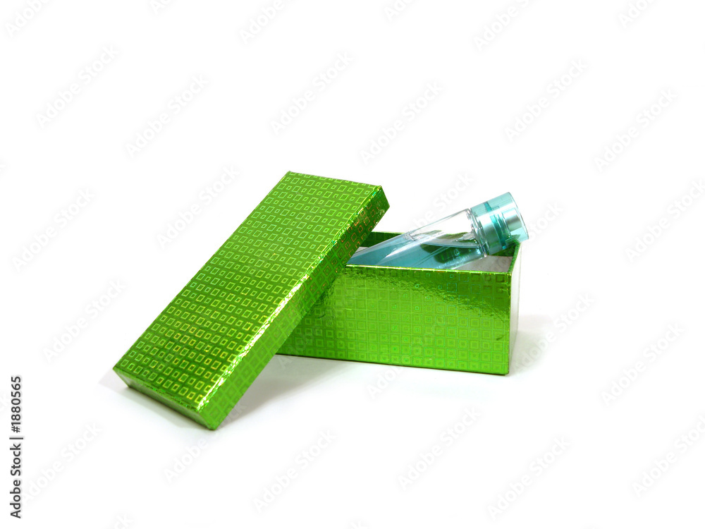 bottle of perfume on green box over white background bottle of perfume on green box over white background