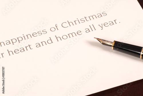 christmas card waiting to be signed by a fountain pen