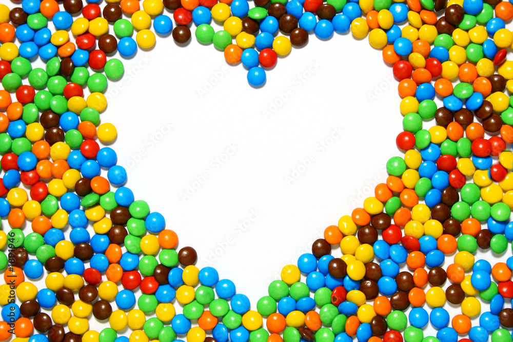 white heart shape with candy background