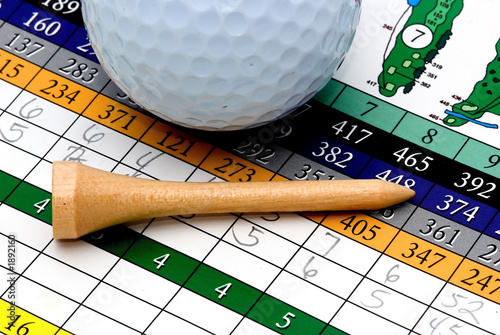 golf tee, scorecard, and ball