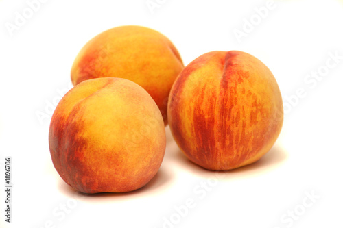 three peaches on white background