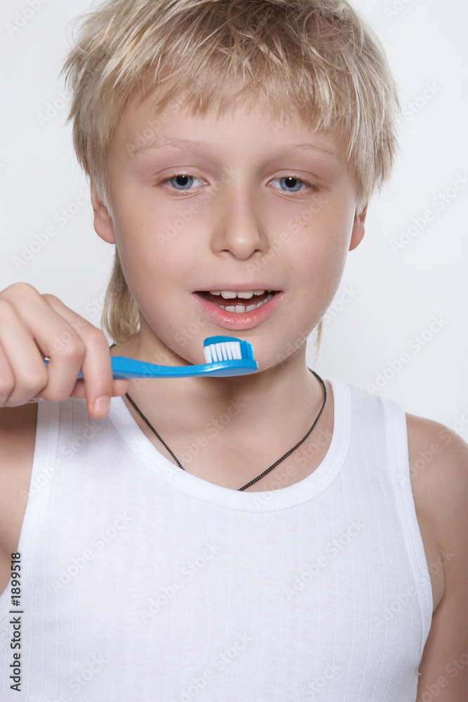 a boy cleans a teeth a tooth-brush. a boy cleans a teeth a tooth-brush.