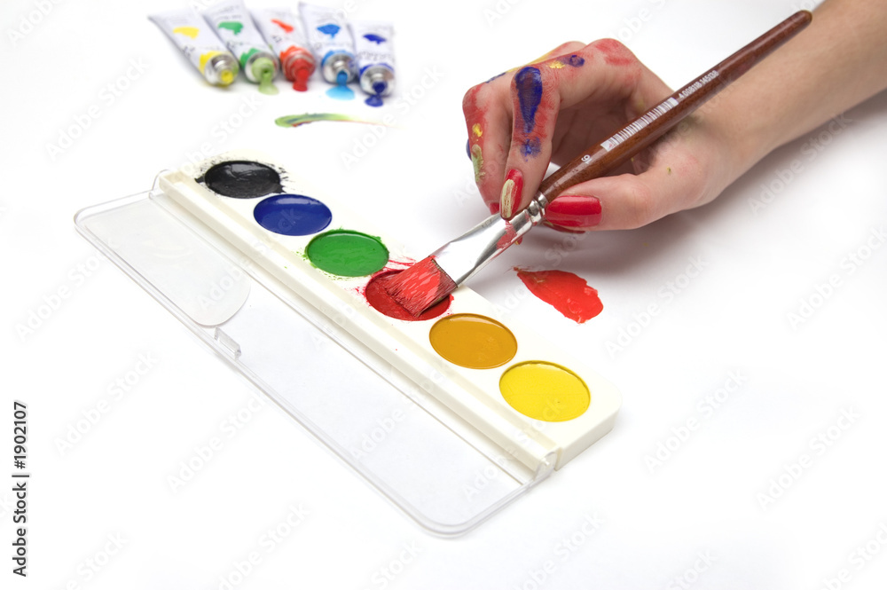 colourful hand taking paints with a brush colourful hand taking paints with a brush
