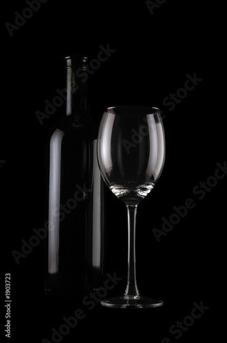bottle of wine and empty glass