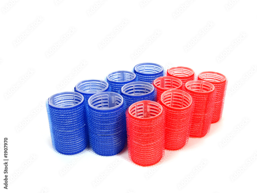 blue and red hair curlers over white background blue and red hair curlers over white background