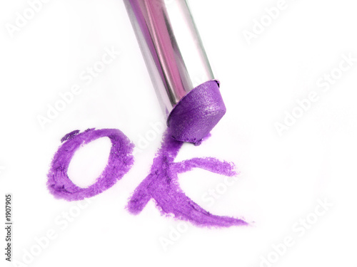 drawing a word ok with violet lipstick photo