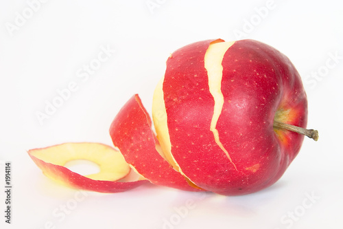 half peeled red apple