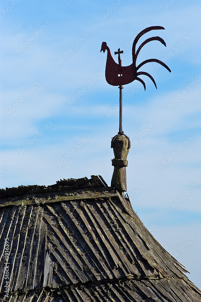 detail of wooden cock on a wooden roof detail of wooden cock on a wooden roof