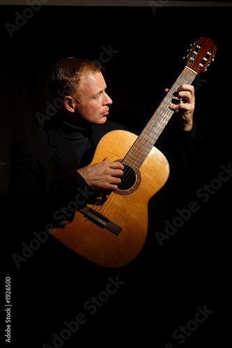 man playing a guitar