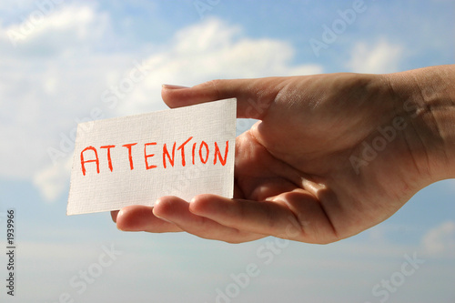hand holding attention card