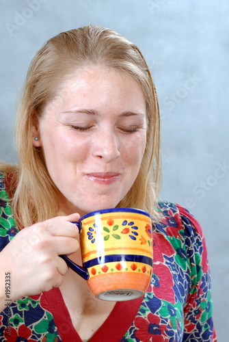 woman drinking coffee or tea