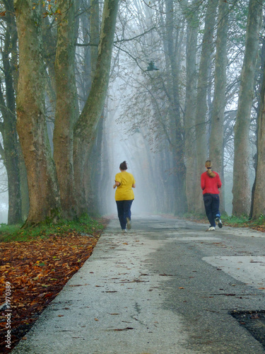 couple jogging in logn alley