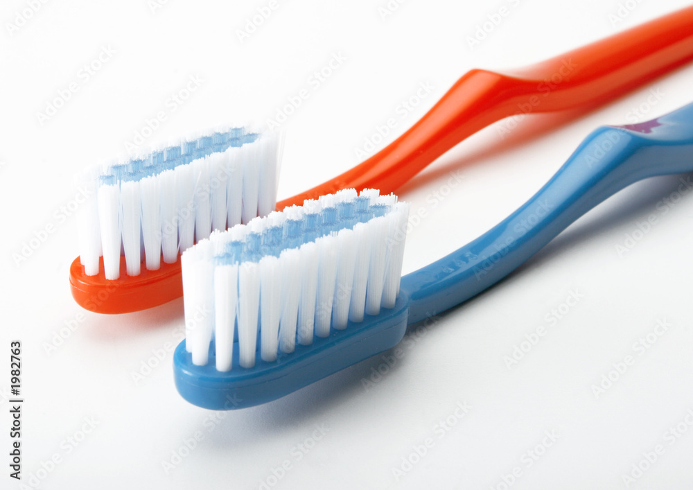 red and white toothbrush red and white toothbrush