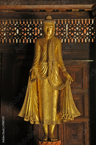 myanmar, salay: statue in a yosqson kyaung in salay monastery photo