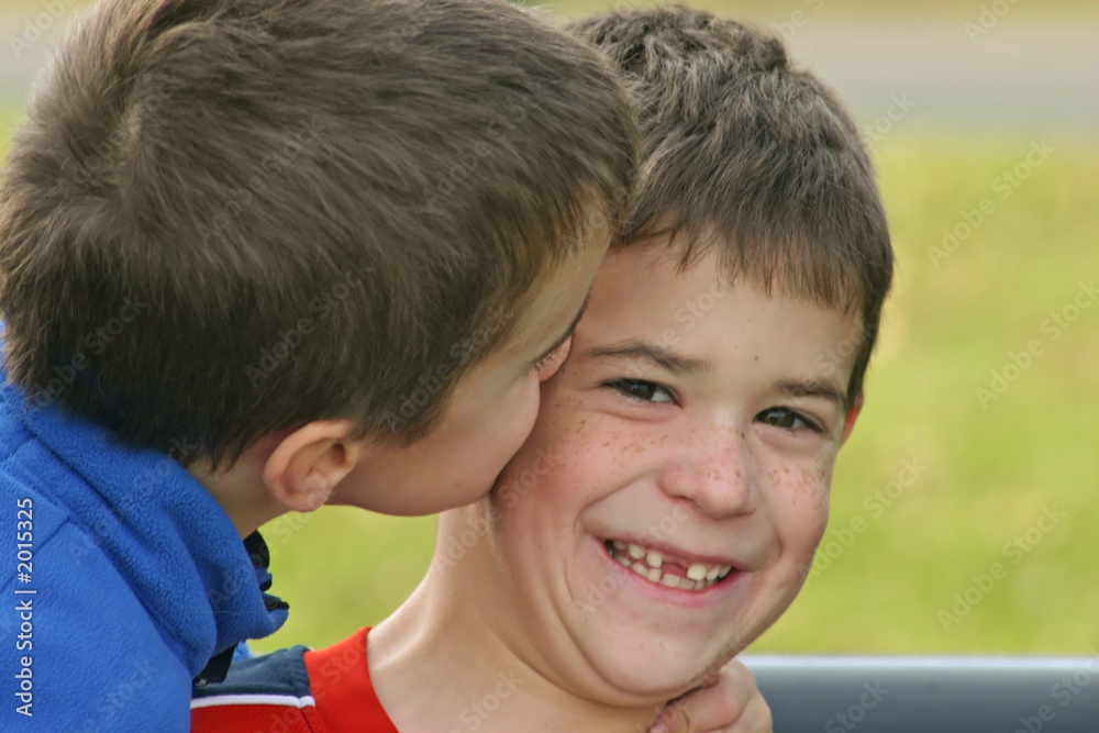 Boy Kissing Brother Stock Photo 