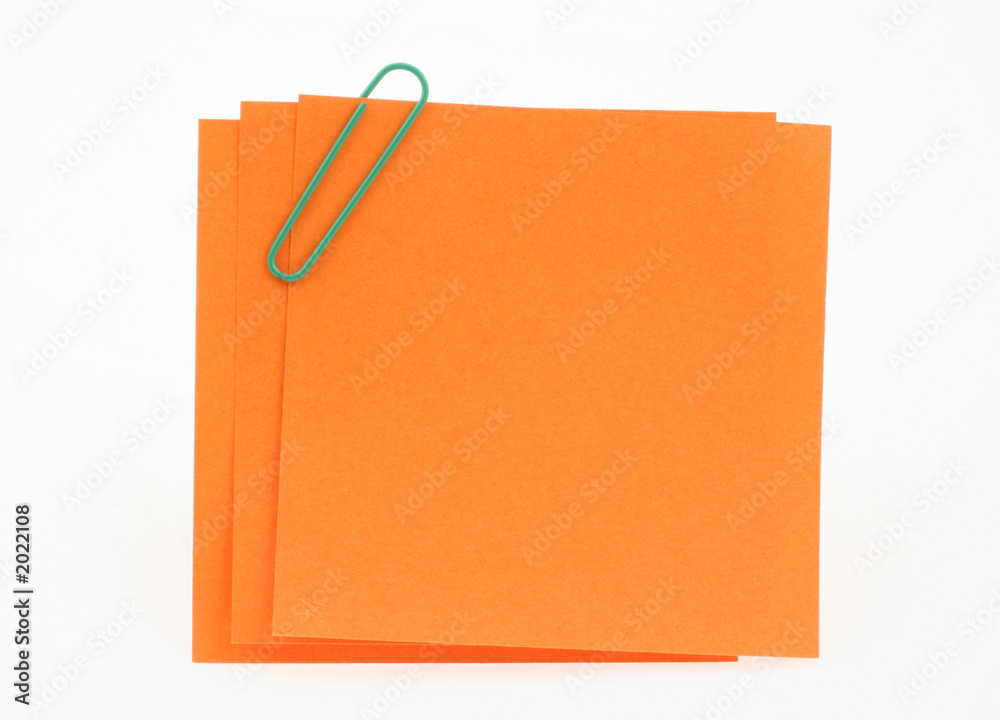 three post-it notes with green paperclip three post-it notes with green paperclip