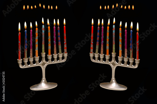 pair of menorahs on black photo