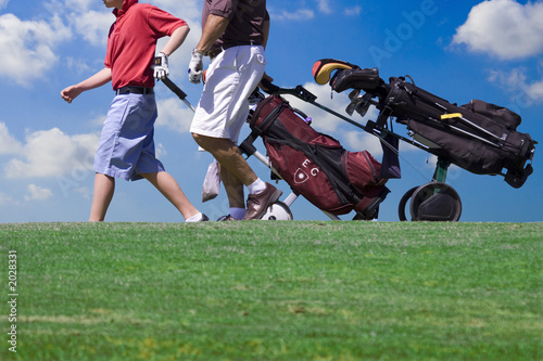 two golfer walking photo