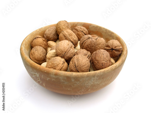 walnuts in a bowl, isolated on white