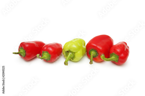green pepper standing out from the crowd of red pe