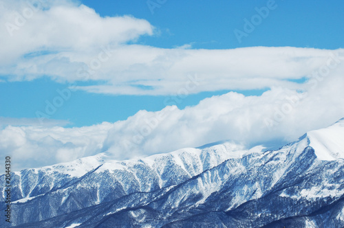 mountains under snow in bright winter day