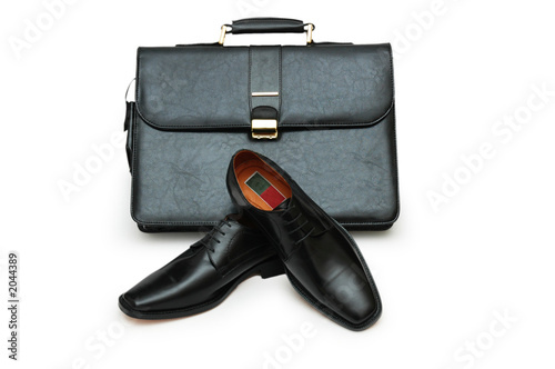 black briefcase and male shoes isolated on white