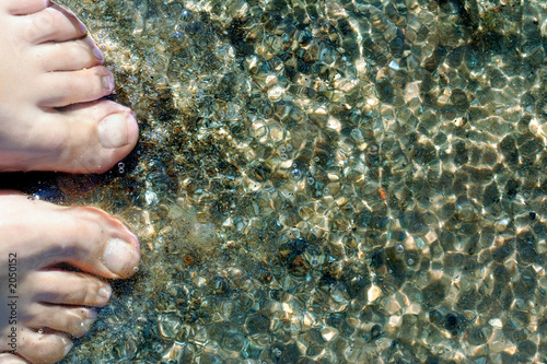 feet on seashore