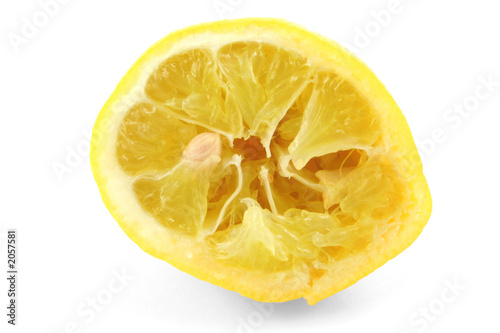 squeezed out lemon on white background