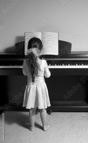 girl playing piano