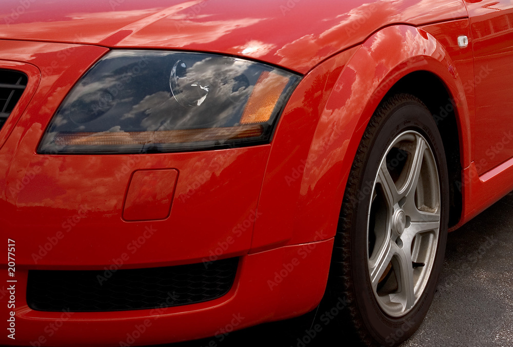 red sports car headlamp. red sports car headlamp.