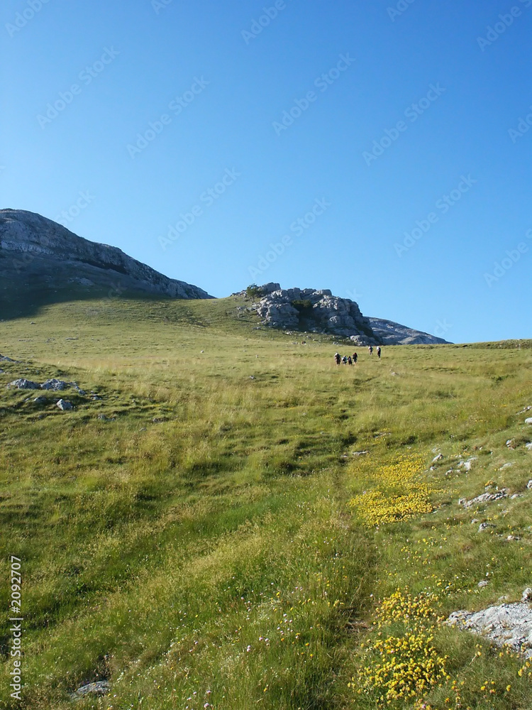 teambuilding in mountain landscape over clouds bac teambuilding in mountain landscape over clouds bac