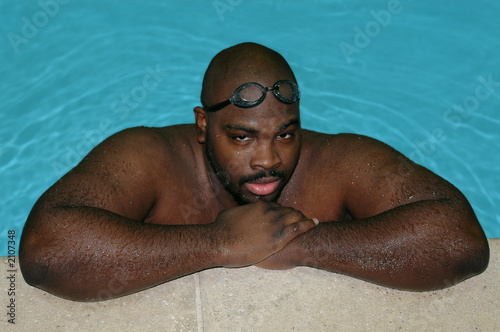 man at an indoor pool