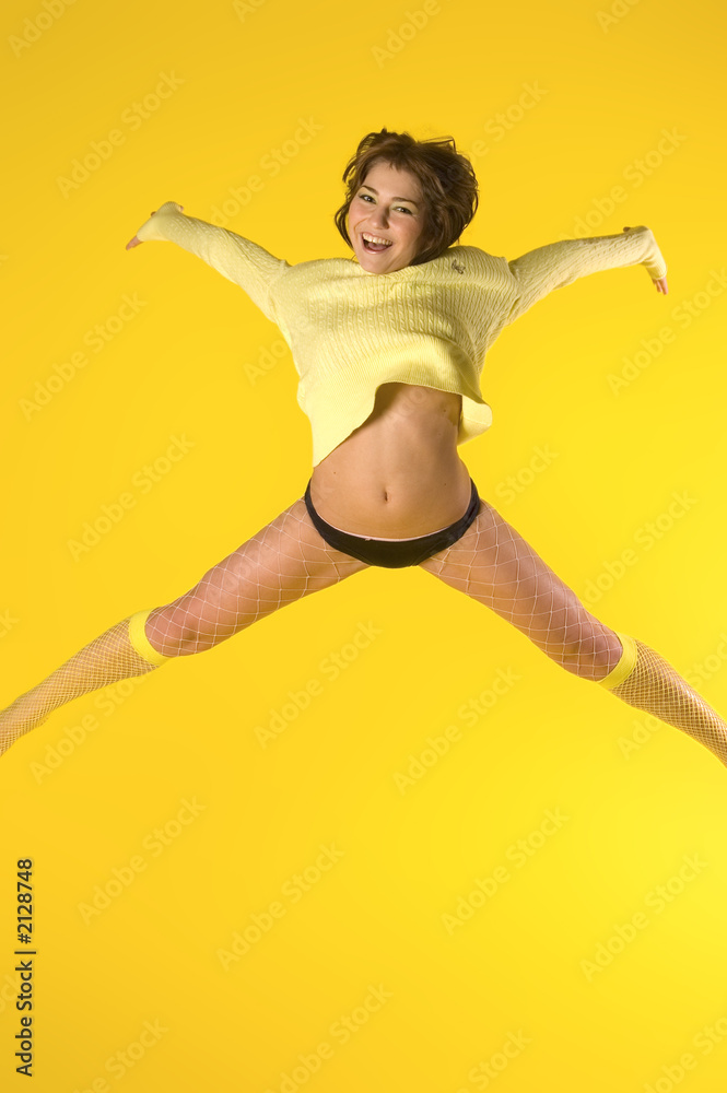 happy model jumping energetically