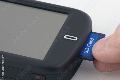 man inserts sd card