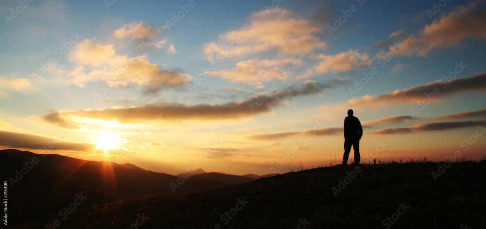 Obraz premium man on the sunset background