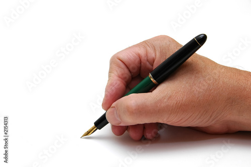 man writing with fountainpen photo